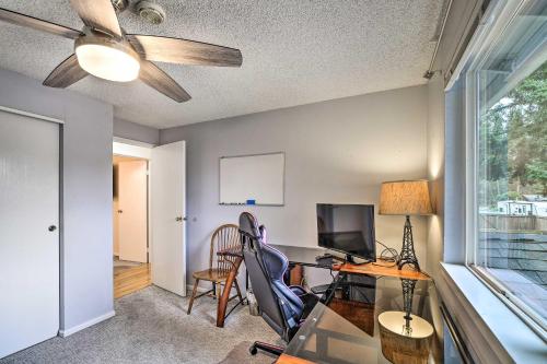 a room with a desk with a computer and a window at Spacious Kent Getaway with Yard, Deck and Grill! in Kent