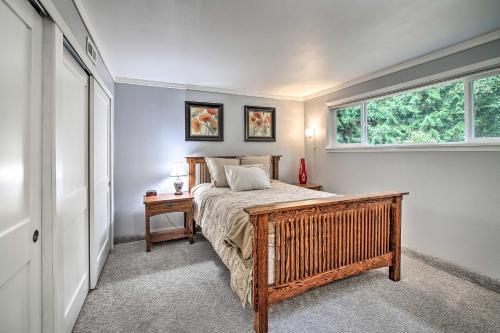 a bedroom with a bed and a window at Spacious Kent Getaway with Yard, Deck and Grill! in Kent