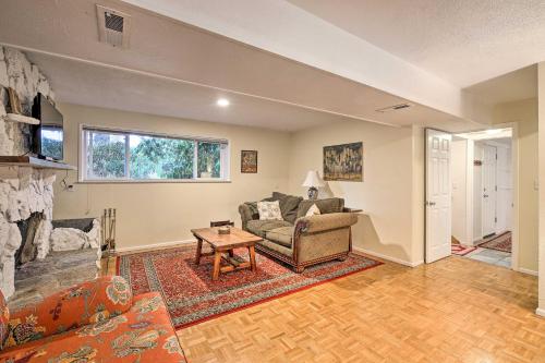 a living room with a couch and a table at Spacious Kent Getaway with Yard, Deck and Grill! in Kent