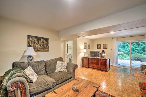 a living room with a couch and a table at Spacious Kent Getaway with Yard, Deck and Grill! in Kent
