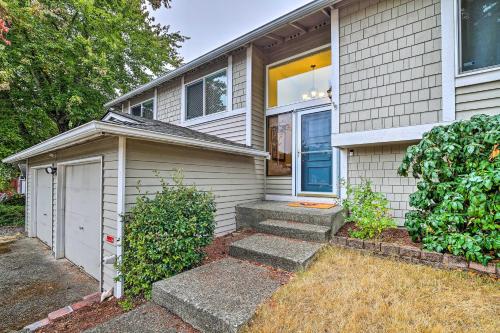 a house with a door and a garage at Spacious Kent Getaway with Yard, Deck and Grill! in Kent