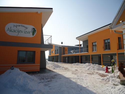 a pile of snow in front of a building at Apartments Akacijev Izvir in Miklavž na Dravskem Polju