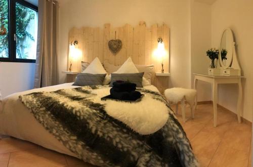 a bedroom with a large bed with pillows at Deluxe - Le millésime - Calme in Strasbourg