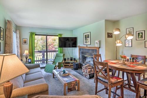 a living room with a couch and a table at Comfortable Dover Apartment Walk to Mt Snow! in Dover