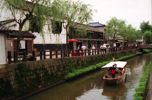 a group of people in a boat on a river at Narita U-City Hotel in Narita