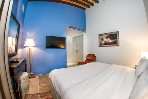 Postel nebo postele na pokoji v ubytování Madama Residence