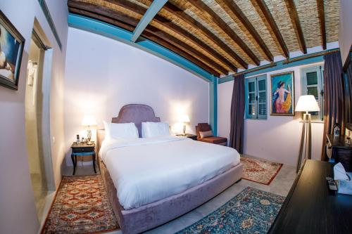 Postel nebo postele na pokoji v ubytování Madama Residence