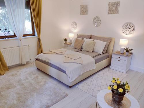 a bedroom with a large bed in a room at Patak apartman in Eger