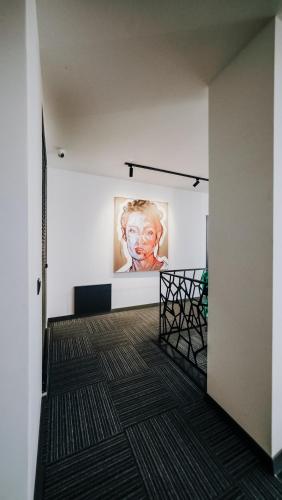 a hallway with a painting on the wall in a building at Çathan Art Hotel in Ayder Yaylasi