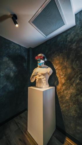 a statue of a mannequin on a stand in a museum at Çathan Art Hotel in Ayder Yaylasi