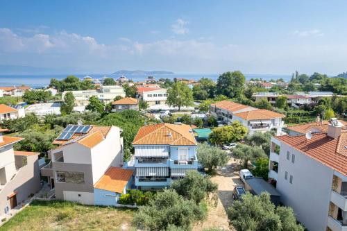 an aerial view of a town with houses at Ninemia Studios in Limenas