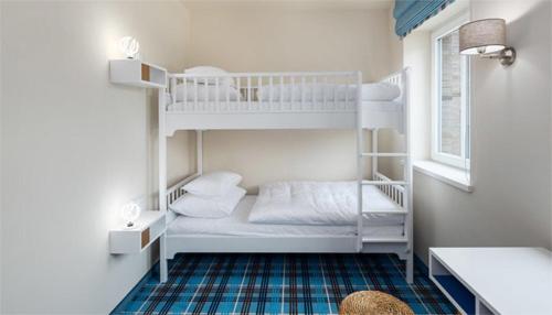 Ein Bett oder Betten in einem Zimmer der Unterkunft Aalernhüs hotel & spa