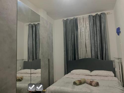 a bedroom with a bed and a large mirror at Appartamento Mire&Geo in Voghera