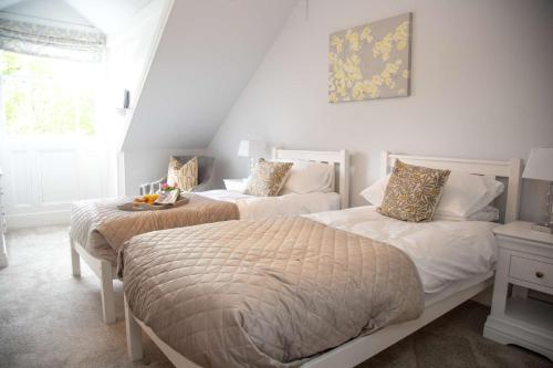 מיטה או מיטות בחדר ב-Redmayne House
