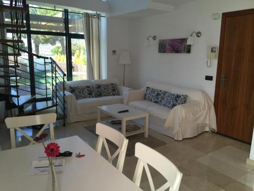 a living room with a couch and a table at Port D'Aro in Platja d'Aro