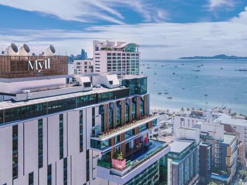 an aerial view of a city with the ocean at Mytt Hotel Pattaya in Pattaya