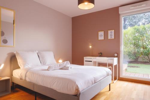 Posteľ alebo postele v izbe v ubytovaní Superbe Appartement Terrasse RDC - NEW LOCATION