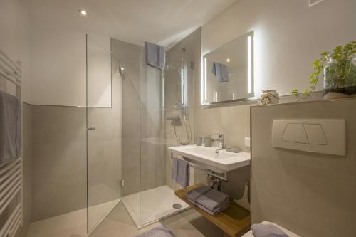 a bathroom with a sink and a shower at Haus Pfistererbauer in Brixen im Thale