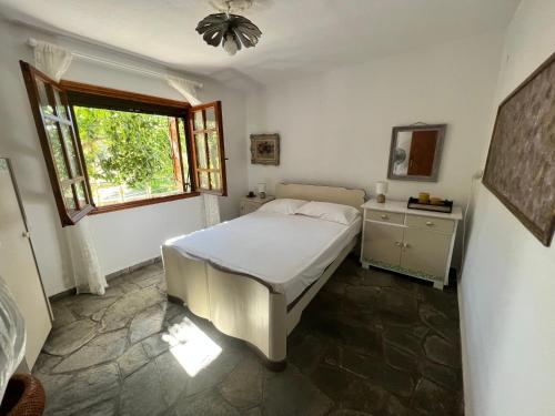 Ένα ή περισσότερα κρεβάτια σε δωμάτιο στο Thassos Allegro Apartment