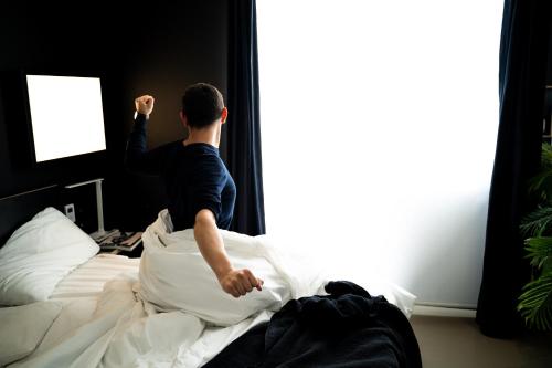 Ein Bett oder Betten in einem Zimmer der Unterkunft Kip Hotel