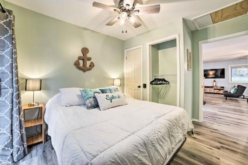 a bedroom with a bed and a ceiling fan at Dog-Friendly Harrison Retreat with Grill and Fire Pit! in Harrison