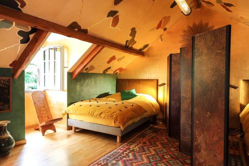 a bedroom with a bed in a room at The Iflissen Pavilion - Luxury Villa in Lamorlaye