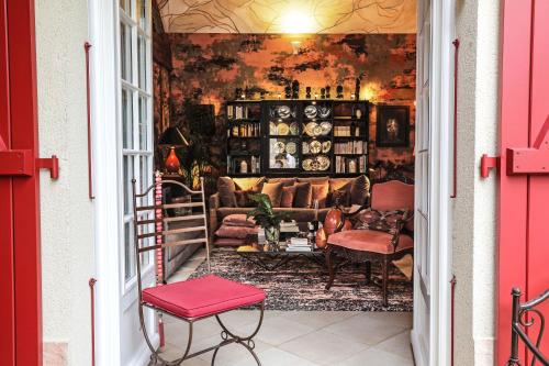 a living room with a couch and a table at The Iflissen Pavilion - Luxury Villa in Lamorlaye