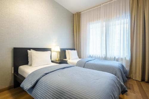 Postel nebo postele na pokoji v ubytování Luxurious Flat with City View in Maslak