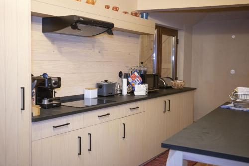 a kitchen with a counter top with a coffee maker at Vale das Maias - Casa de Campo in Laborins