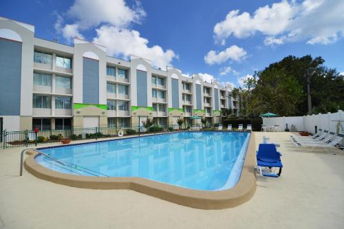 a swimming pool in front of a hotel at Wyndham Garden Tallahassee Capitol Near FSU in Tallahassee