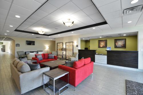 a lobby with couches and tables and a waiting room at Wyndham Garden Tallahassee Capitol Near FSU in Tallahassee