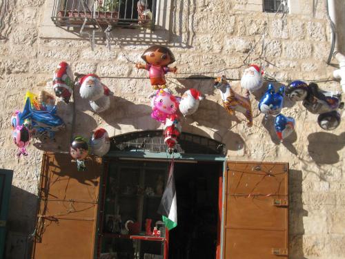 a bunch of stuffed animals on the side of a building at BREAD HOUSE in Bethlehem