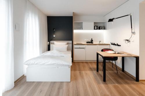 Postel nebo postele na pokoji v ubytování the place Herzogenaurach - Serviced Apartments