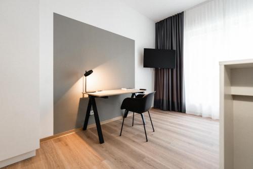 TV a/nebo společenská místnost v ubytování the place Herzogenaurach - Serviced Apartments
