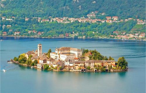 an island in the middle of a large body of water at Gorgeous Home In Artò in Arola