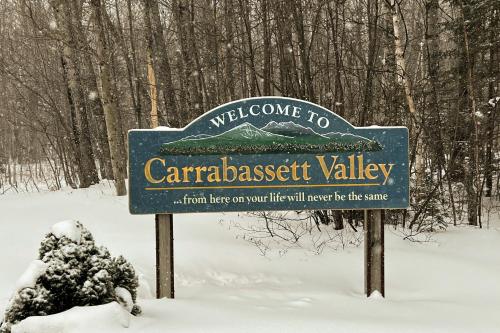 a sign for cararcrest valley in the snow at Snow Lion in Carrabassett