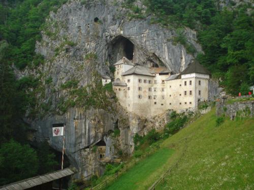 a castle built into the side of a mountain at Apartments Akacijev Izvir in Miklavž na Dravskem Polju