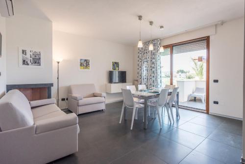 TV a/nebo společenská místnost v ubytování Case Vacanze Porto Cesareo by Porto Cesareo Camping & Village