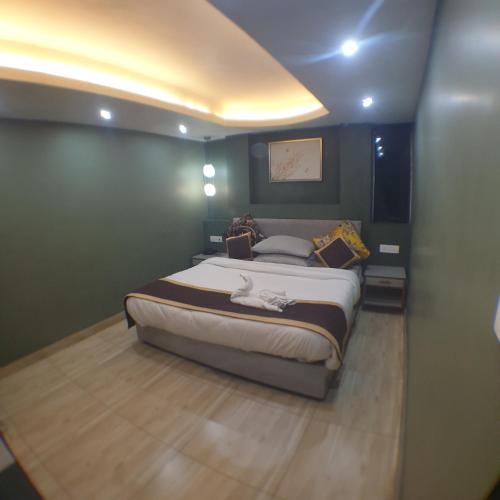 a bedroom with a large bed in a room at Zingo's Home Stay in Darjeeling