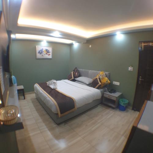 a bedroom with a large bed in a room at Zingo's Home Stay in Darjeeling
