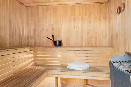 a wooden sauna with a white towel sitting in it at Best Western Hotel Esplanade in Västerås