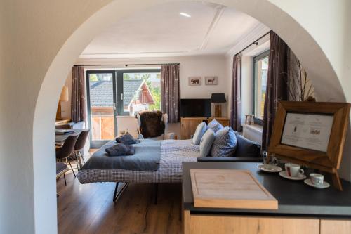 a living room with a couch and a table at Mountainlodge Tirol Berwang in Berwang