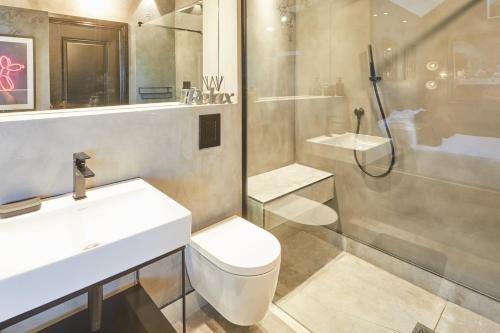 a bathroom with a shower and a toilet and a sink at Host & Stay - The Stables in Yarm