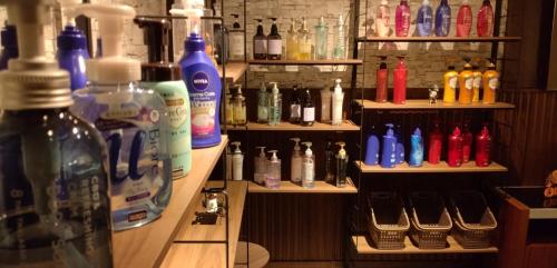 a room with shelves filled with lots of bottles at 水戸PARCO in Mito