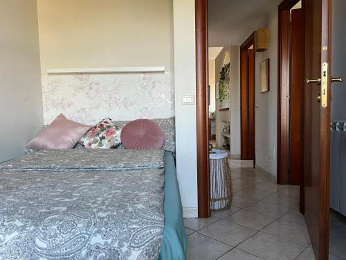 a bedroom with a bed and a hallway at Casa Italia Hospitality in Lunghezza