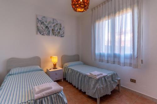Una cama o camas en una habitación de Residence Albarella