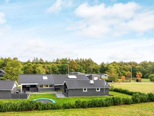 a house in the countryside with a yard at 8 person holiday home in Hovborg in Hovborg