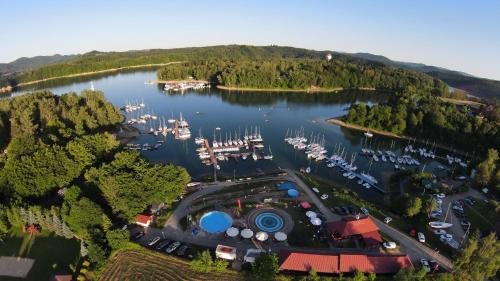 an aerial view of a marina with boats in the water at Przystań Caryńska w Polańczyku in Polańczyk
