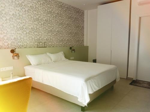 Ένα ή περισσότερα κρεβάτια σε δωμάτιο στο Waypoint Suites
