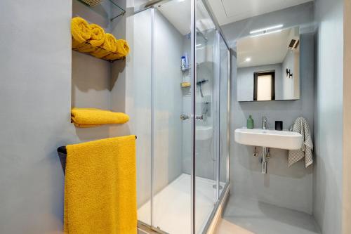 a bathroom with a shower and a sink at Traditional Maltese Townhouse wt Terrace and Pool in Senglea